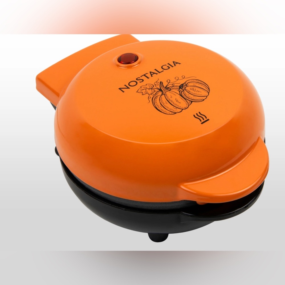 Pumpkin orange mini waffle maker by Nostalgia!! Super compact!! New- manuals!
